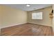 Bedroom with wood-look floors and one window with blinds at 6236 Mount Palomar Ave, Las Vegas, NV 89139