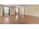 Bright, open bedroom with hardwood floors, modern chandelier, and ample natural light at 6236 Mount Palomar Ave, Las Vegas, NV 89139
