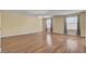 Spacious bedroom with ample natural light, hardwood floors and a modern chandelier at 6236 Mount Palomar Ave, Las Vegas, NV 89139