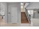 Grand foyer showcasing hardwood stairs, contemporary lighting, and a view of the dining area at 6236 Mount Palomar Ave, Las Vegas, NV 89139