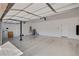 Spacious garage with epoxy flooring, ample room for vehicles, and a side door at 6236 Mount Palomar Ave, Las Vegas, NV 89139