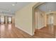 Hallway showing hardwood flooring, neutral walls, and views to the adjacent living room and bedroom at 6236 Mount Palomar Ave, Las Vegas, NV 89139