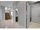 Hallway features tile floors, a staircase, and multiple doorways at 6236 Mount Palomar Ave, Las Vegas, NV 89139