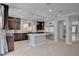 Modern kitchen featuring a center island, stainless steel appliances, and tile flooring at 6236 Mount Palomar Ave, Las Vegas, NV 89139