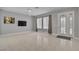 Spacious living room featuring tile flooring, decorative door and natural light at 6236 Mount Palomar Ave, Las Vegas, NV 89139