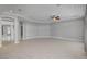 Spacious living room featuring tile flooring, modern ceiling fan and gray walls at 6236 Mount Palomar Ave, Las Vegas, NV 89139