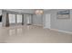 Spacious living room featuring tile flooring, chandelier, and natural light at 6236 Mount Palomar Ave, Las Vegas, NV 89139