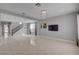 Spacious living room featuring tile flooring, staircase, and natural light at 6236 Mount Palomar Ave, Las Vegas, NV 89139