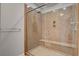 Elegant walk-in shower showcasing glass enclosure, a built-in seat, and designer fixtures at 6236 Mount Palomar Ave, Las Vegas, NV 89139