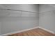 Walk-in closet featuring custom shelving and hardwood flooring at 6236 Mount Palomar Ave, Las Vegas, NV 89139