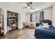 Comfortable bedroom with ample closet space and a built-in desk area at 6445 N Alpine Ridge Way, Las Vegas, NV 89149