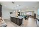 Expansive kitchen overlooking the living area, boasting a large island and modern appliances at 6445 N Alpine Ridge Way, Las Vegas, NV 89149