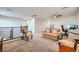 Open loft area with comfortable seating, a ceiling fan, and ample natural light at 6445 N Alpine Ridge Way, Las Vegas, NV 89149
