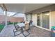 Covered patio with brick flooring, perfect for outdoor dining and entertaining at 6445 N Alpine Ridge Way, Las Vegas, NV 89149
