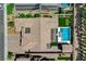 Stunning aerial view of a home with a pool, spa, putting green, and well-manicured landscaping at 7095 Falabella Ridge Ave, Las Vegas, NV 89131