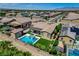 Aerial view showcases a private backyard with pool, spa, putting green, and outdoor living space at 7095 Falabella Ridge Ave, Las Vegas, NV 89131