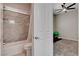 Bright bathroom with modern tile and shower and a green exercise ball at 7095 Falabella Ridge Ave, Las Vegas, NV 89131