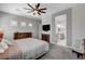 Spacious bedroom with shutters, tv, and ornate wooden furniture at 7095 Falabella Ridge Ave, Las Vegas, NV 89131