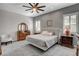 Cozy bedroom featuring a decorative ceiling fan, a luxurious king bed, and matching furniture at 7095 Falabella Ridge Ave, Las Vegas, NV 89131