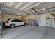 Epoxy garage interior with car, storage, and tool organization creating an efficient space at 7095 Falabella Ridge Ave, Las Vegas, NV 89131