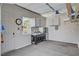 Clean garage interior with a window, storage cabinets, and tool organizers at 7095 Falabella Ridge Ave, Las Vegas, NV 89131