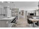 Modern kitchen boasts stainless steel appliances, an island with barstool seating, and an open floor plan at 7095 Falabella Ridge Ave, Las Vegas, NV 89131