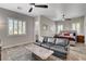 Bright and airy main bedroom featuring a comfortable seating area and plush carpeting at 7095 Falabella Ridge Ave, Las Vegas, NV 89131