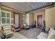 Relaxing covered patio with comfortable seating, ideal for outdoor entertaining at 7095 Falabella Ridge Ave, Las Vegas, NV 89131