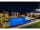 Stunning backyard with a sparkling pool, spa, and lush landscaping for the ultimate relaxation at 7095 Falabella Ridge Ave, Las Vegas, NV 89131