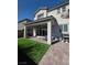 Outdoor space featuring artificial grass, paved patio, and covered seating area at 7114 Superstar St, North Las Vegas, NV 89084