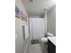 Bathroom with a gray shower curtain at 7114 Superstar St, North Las Vegas, NV 89084