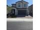 Charming two-story home with a two-car garage and a beautifully landscaped front yard at 7114 Superstar St, North Las Vegas, NV 89084
