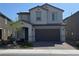 Charming two-story home with a two-car garage and a beautifully landscaped front yard at 7114 Superstar St, North Las Vegas, NV 89084