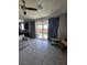 Open living room area with sliding glass doors leading to the backyard and views of the outdoor space at 7114 Superstar St, North Las Vegas, NV 89084