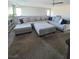 Open living space with a sectional sofa and natural light, perfect for relaxation at 7114 Superstar St, North Las Vegas, NV 89084