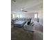 Open-concept living room with plush sectional sofa and ceiling fan at 7114 Superstar St, North Las Vegas, NV 89084