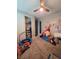Spacious playroom with carpet, filled with toys, a mini trampoline, and educational decor for  at 7114 Superstar St, North Las Vegas, NV 89084