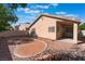 Desert landscaped backyard with brick patio, perfect for outdoor entertaining, with covered patio at 7116 Wonderberry St, Las Vegas, NV 89131