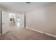 Neutral bedroom featuring carpet and a view of the kitchen at 7116 Wonderberry St, Las Vegas, NV 89131