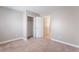 Bright bedroom with carpet, closet and a doorway to the Primary bathroom at 7116 Wonderberry St, Las Vegas, NV 89131