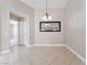 Open dining area with tile floors, contemporary light fixture, and neutral walls at 7116 Wonderberry St, Las Vegas, NV 89131