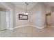 Bright dining area features tile floors, neutral colors, and modern light fixtures at 7116 Wonderberry St, Las Vegas, NV 89131