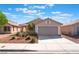 Charming single-story home with a two-car garage and a well-maintained front yard at 7116 Wonderberry St, Las Vegas, NV 89131
