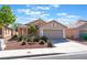 Inviting single-story home with well-maintained desert landscaping and an attached two-car garage at 7116 Wonderberry St, Las Vegas, NV 89131