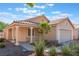 Beautiful one-story home featuring desert landscaping, a tile roof, and a covered porch at 7116 Wonderberry St, Las Vegas, NV 89131