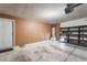 Spacious garage with white walls and concrete floors, with utility features ready for the homeowner at 7116 Wonderberry St, Las Vegas, NV 89131