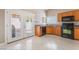 Cozy kitchen with wood cabinets, black appliances, and granite countertops at 7116 Wonderberry St, Las Vegas, NV 89131