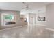 Bright living room featuring an open layout with large windows at 7116 Wonderberry St, Las Vegas, NV 89131