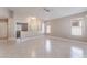 Spacious living room features tile floors, recessed lighting, and neutral paint colors at 7116 Wonderberry St, Las Vegas, NV 89131