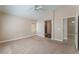 Spacious main bedroom featuring neutral carpet and ceiling fan at 7116 Wonderberry St, Las Vegas, NV 89131